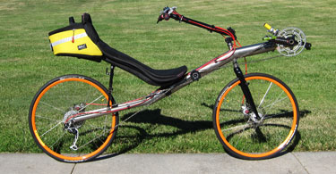 Photo of T-Bone high racer with 26 inch orange wheels